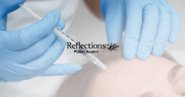 Botox application at Reflections at St. Luke’s Plastic Surgery in the Tampa Bay area, showing a medical professional in blue gloves carefully administering an injection to a woman’s forehead while she rests with her eyes closed